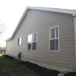 Miller, left side of house after we installed James Hardie fiber cement siding, trim, and Mid-America gable vent.